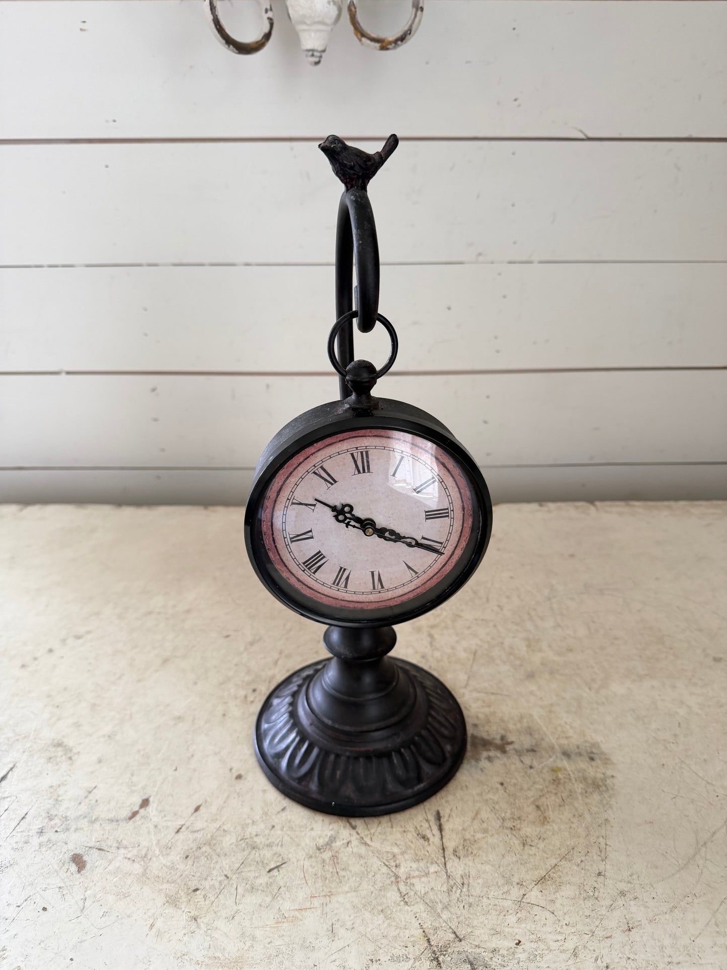 Pocket watch on a stand with a bird on top clock will get makeover