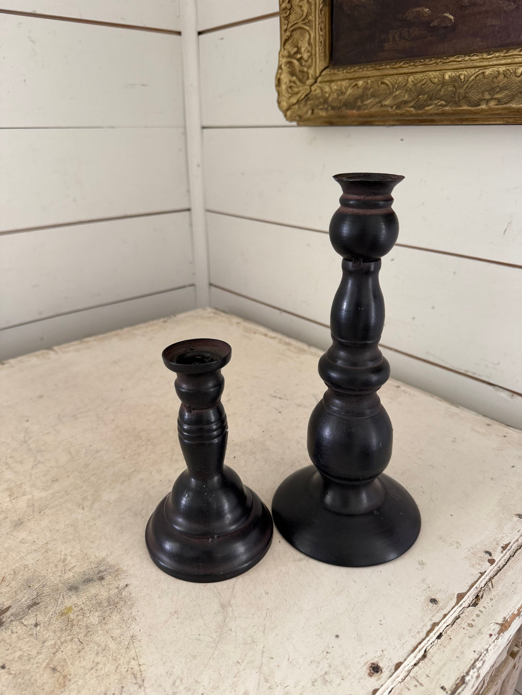 Set of black metal candlesticks