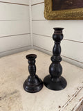Set of black metal candlesticks
