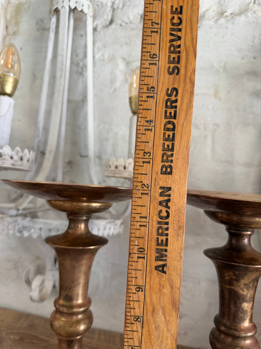 Large oversized pair of copper and brass candle holders will get polished more