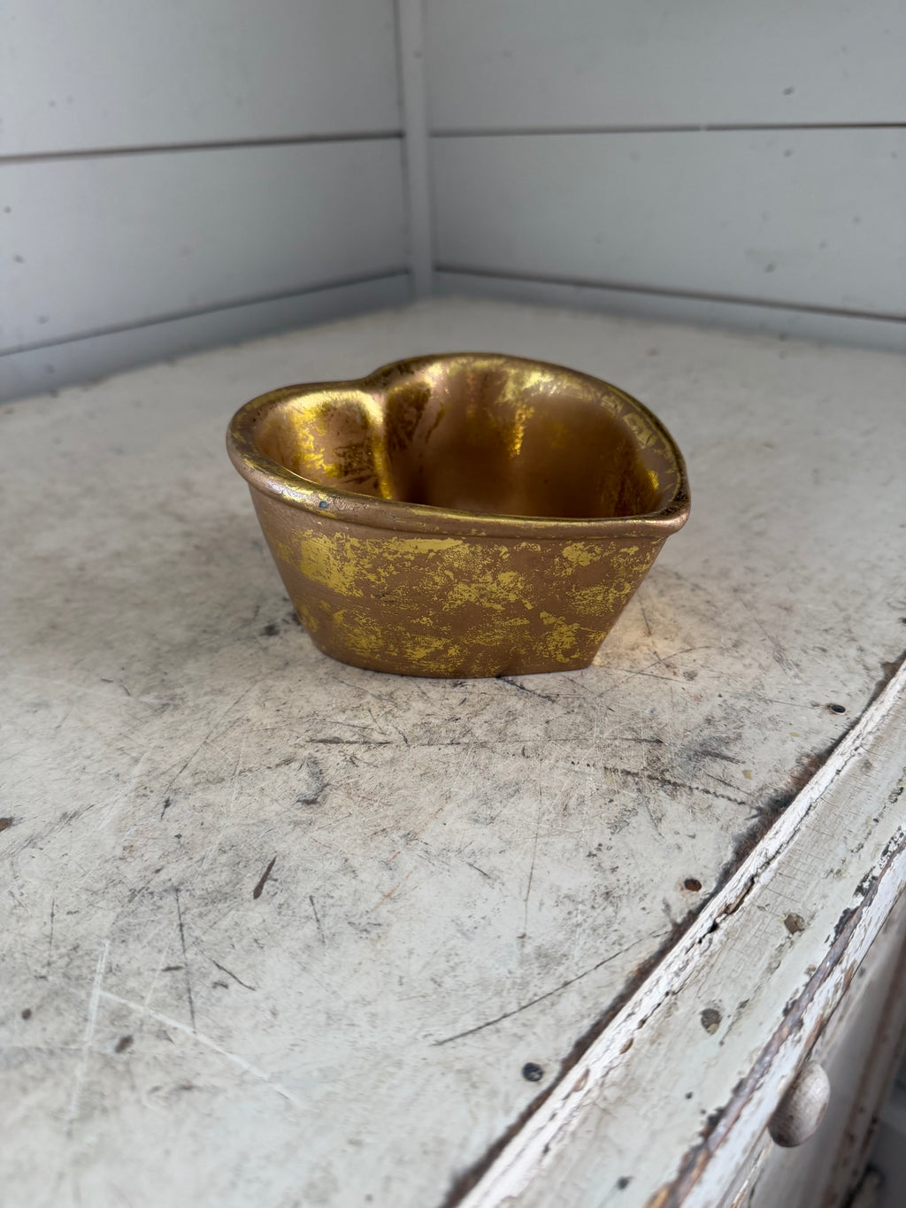 Gold colored heart shaped trinket bowl