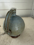 Vintage pottery studio jug has chips at base as shown