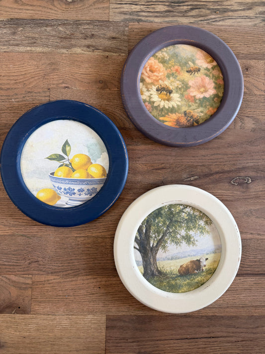 Art in round wood hand painted frame 10.25”