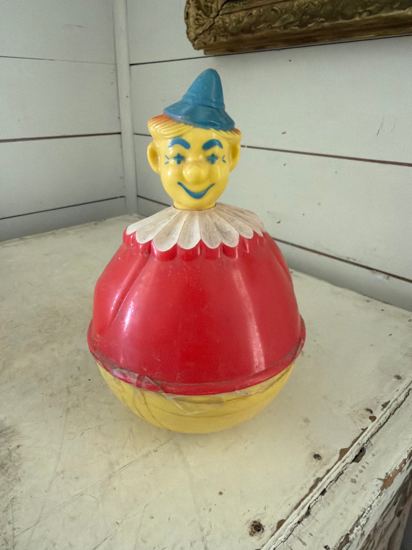 Vintage Roxy Poly Clown Toy has tape on it