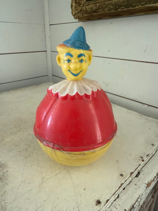 Vintage Roxy Poly Clown Toy has tape on it