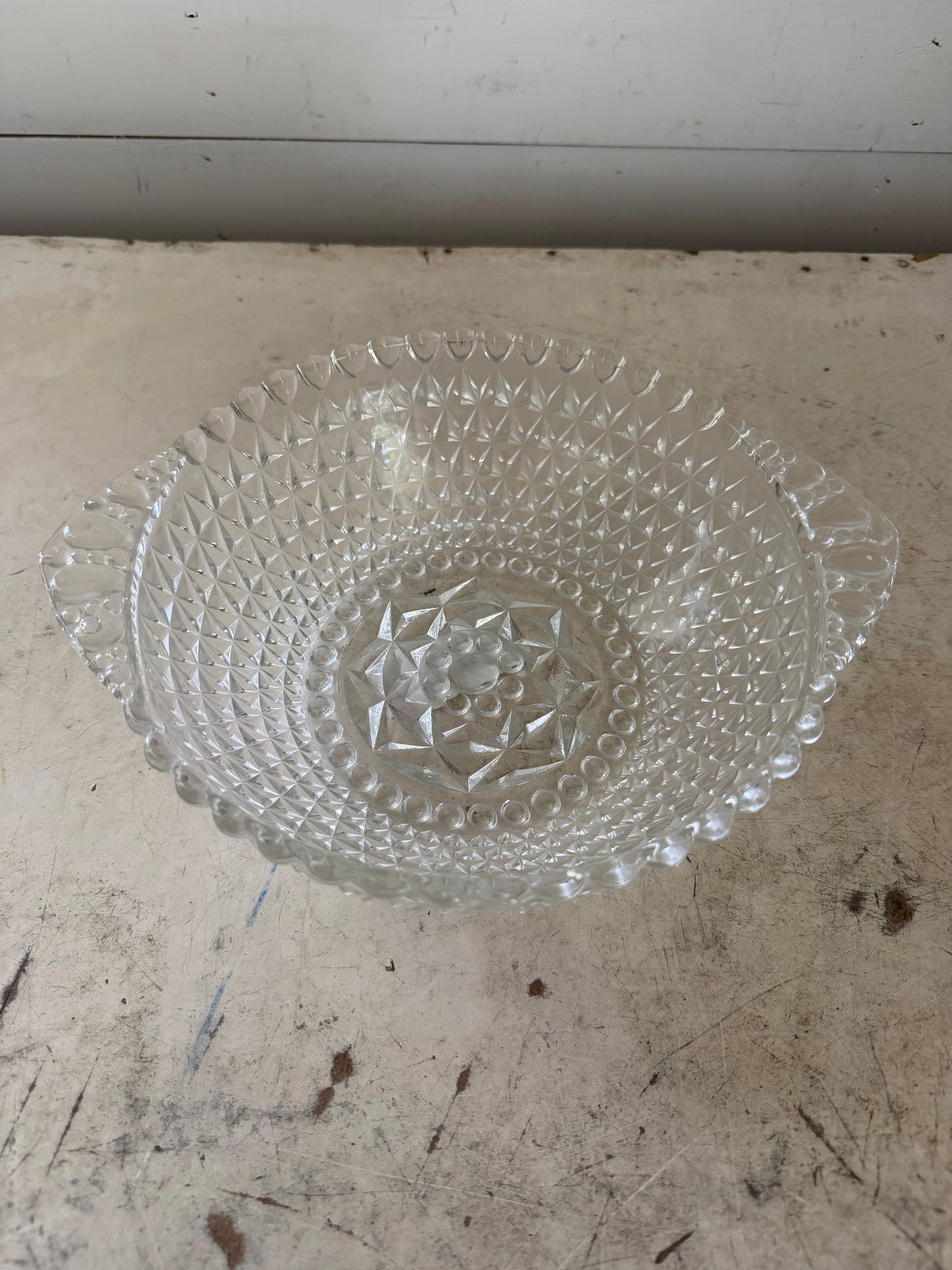 Vintage press glass bowl has small chip as shown