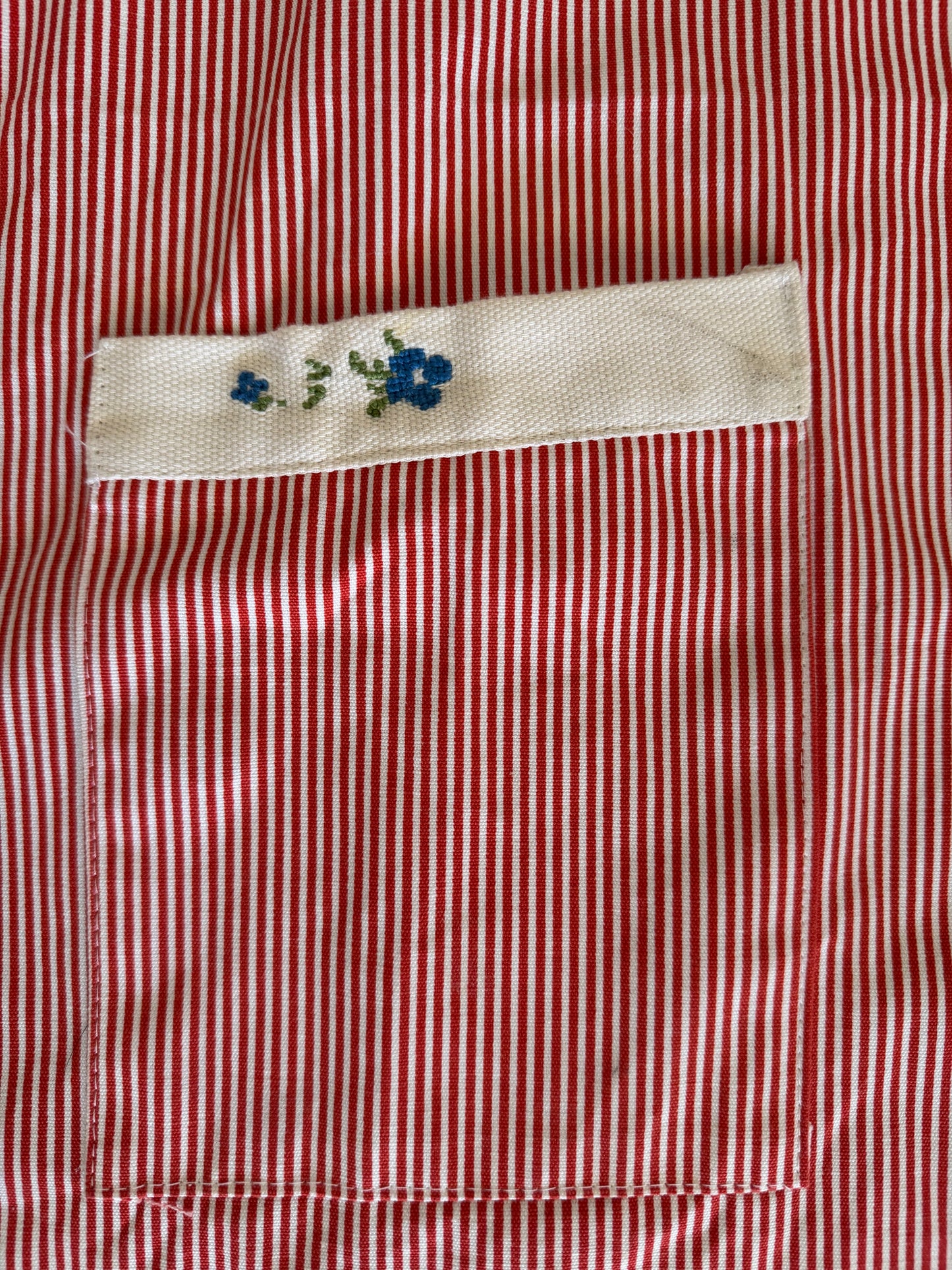 Homemade red and white striped apron with Embroidered Pocket