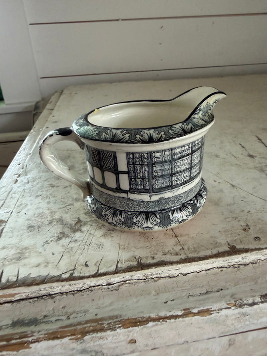 Antique Royal Doulton creamer from the "Old Moreton Hall" series.