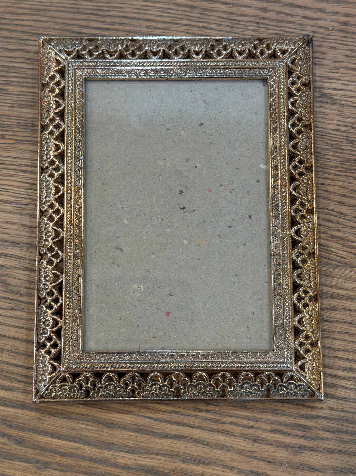 Small ornate brass colored frame will get print