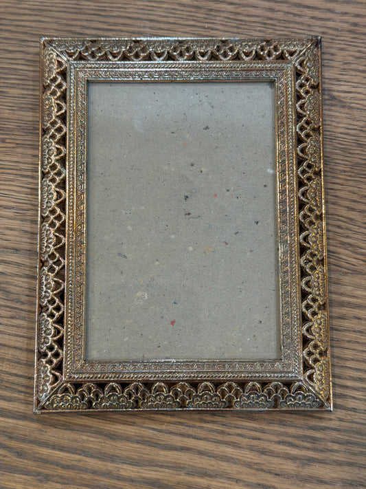 Small ornate brass colored frame will get print