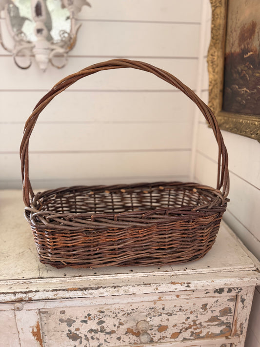 Oval Shaped Brown Wicker Basket With Tall Handle