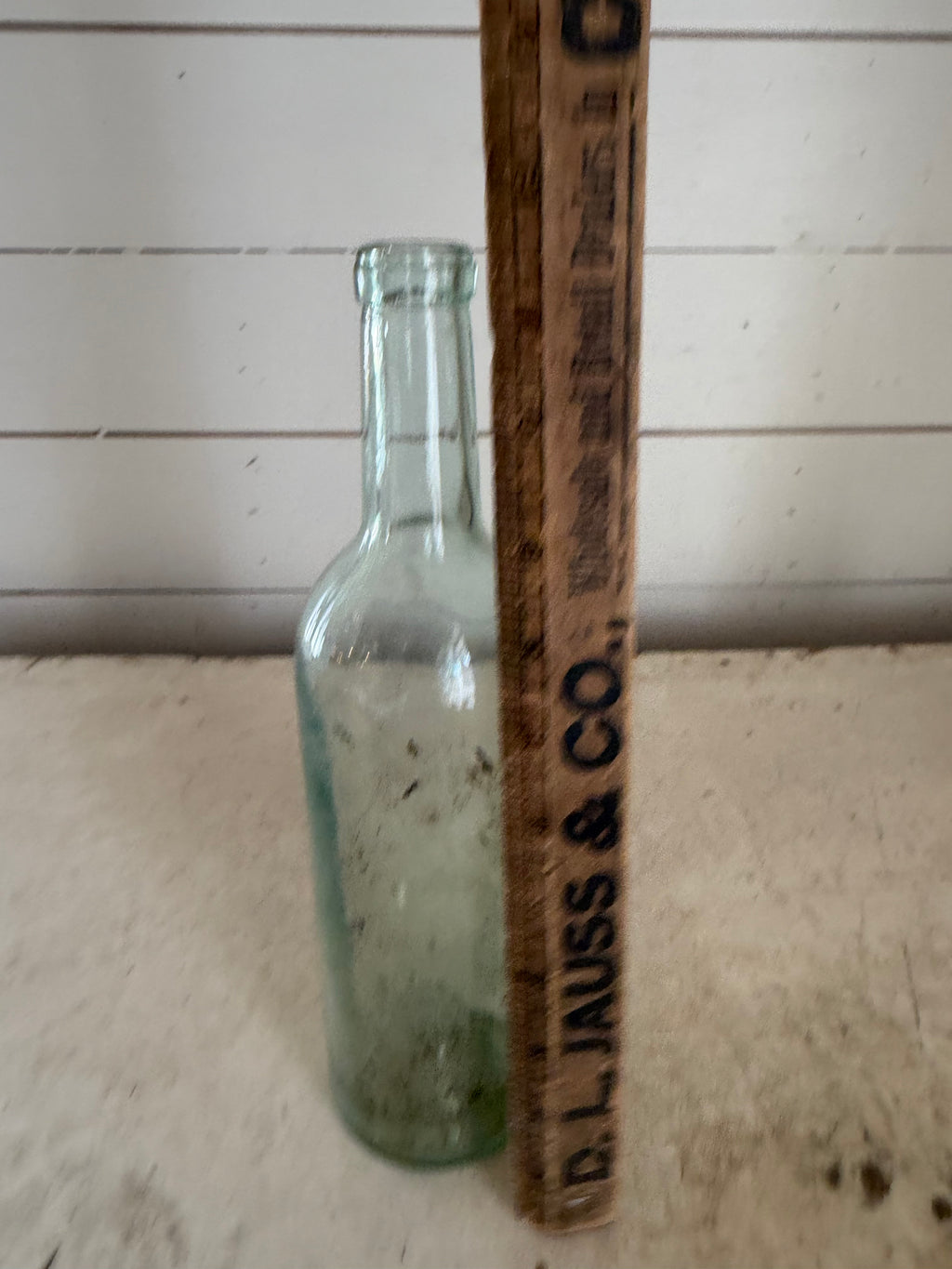 Early 20th Century Hand Blown Light Green Glass Bottle with dimpled bottom