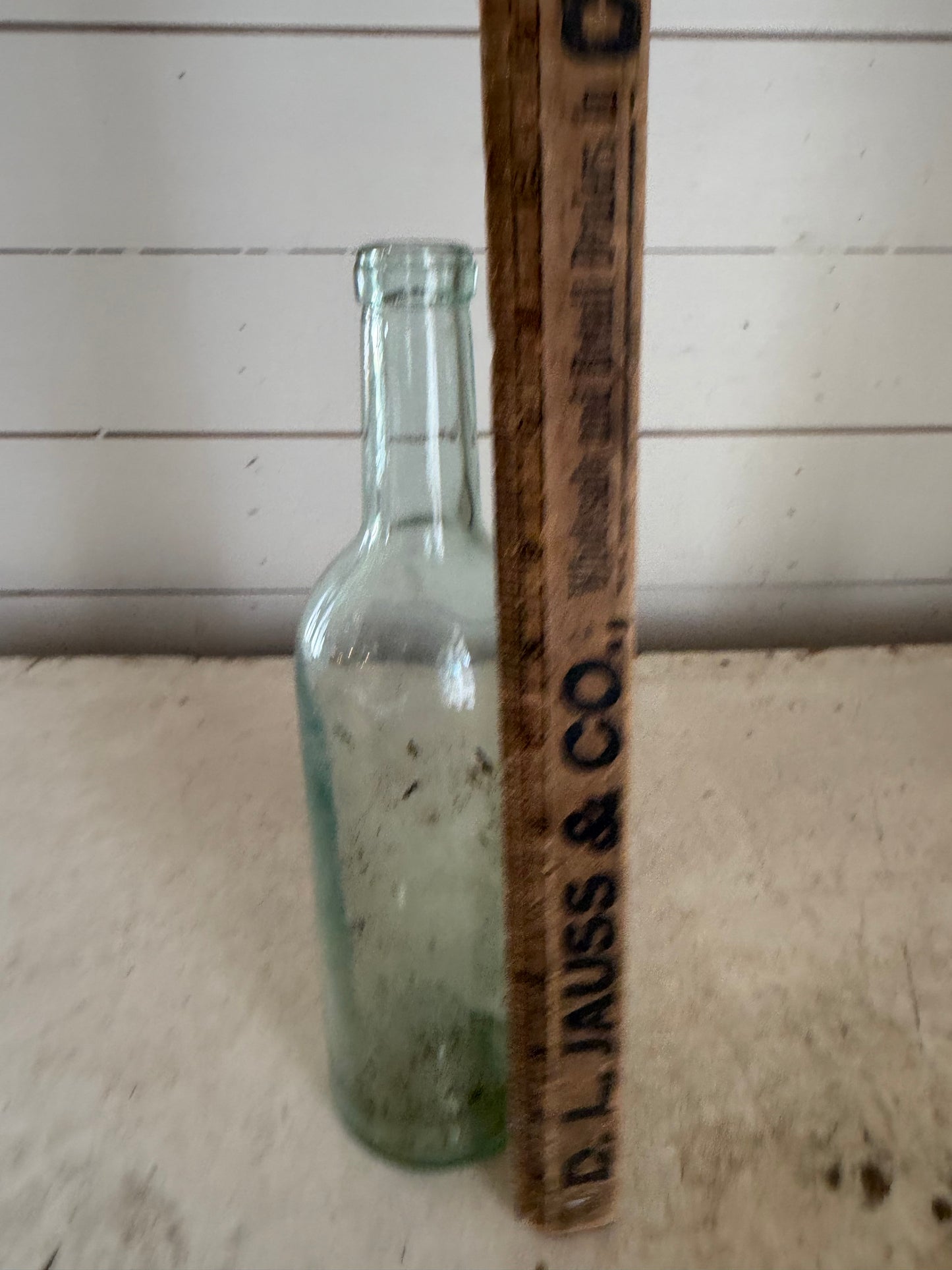 Early 20th Century Hand Blown Light Green Glass Bottle with dimpled bottom