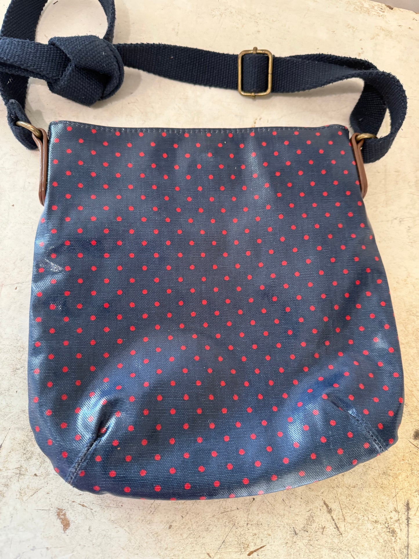 Cath Kidston bag with a navy blue and red polka dot print