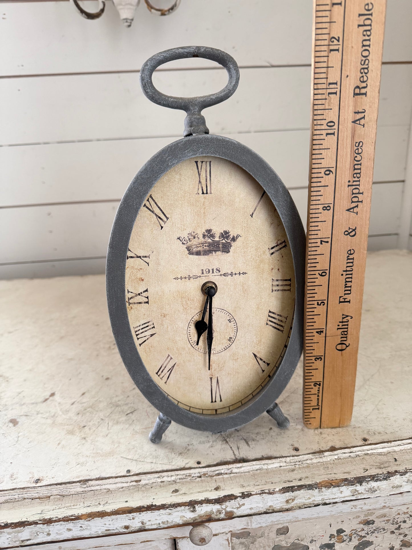 Gray standing oval clock will get makeover