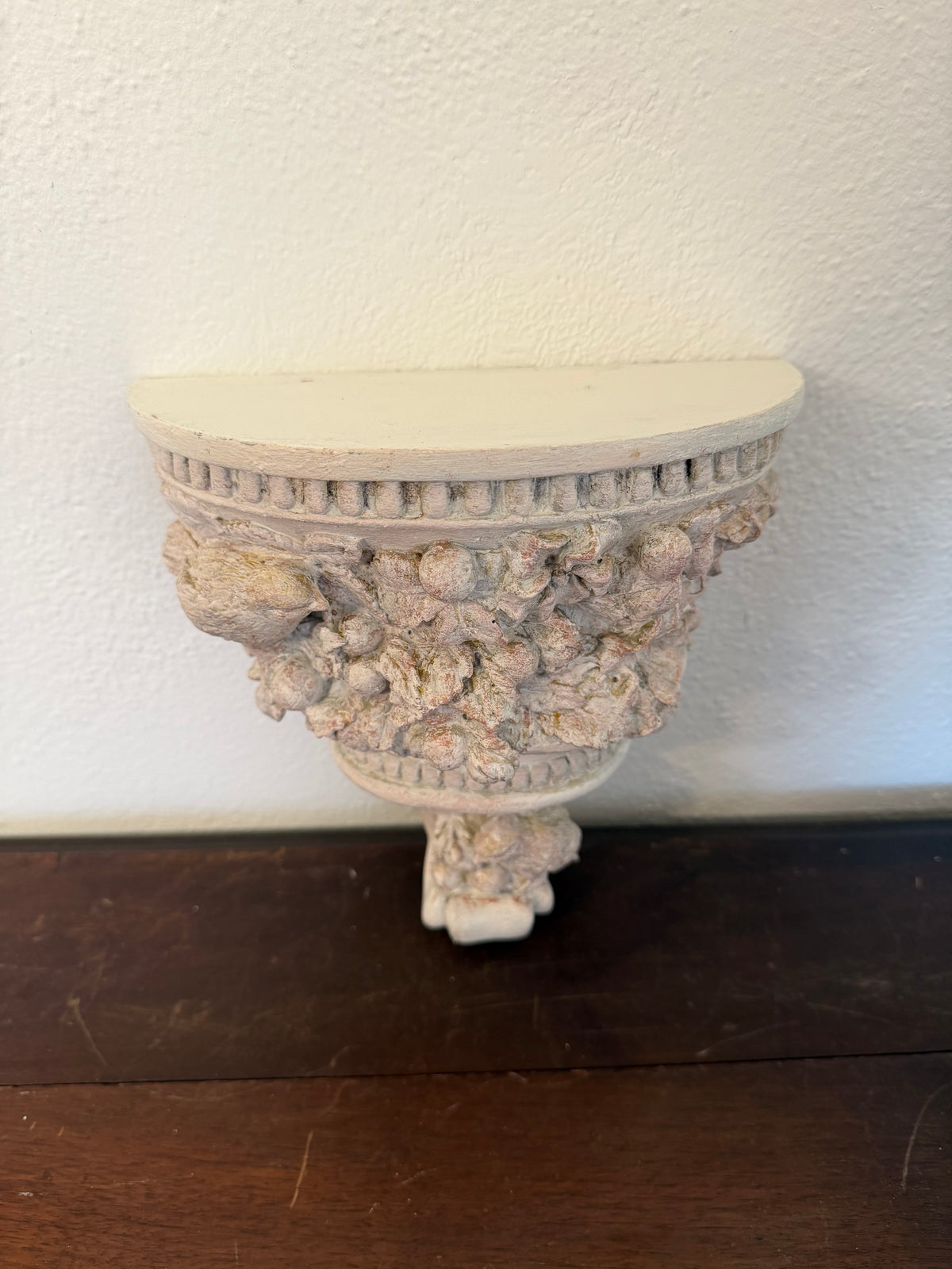 Plaster wall, sconces with flowers and birds will get makeover