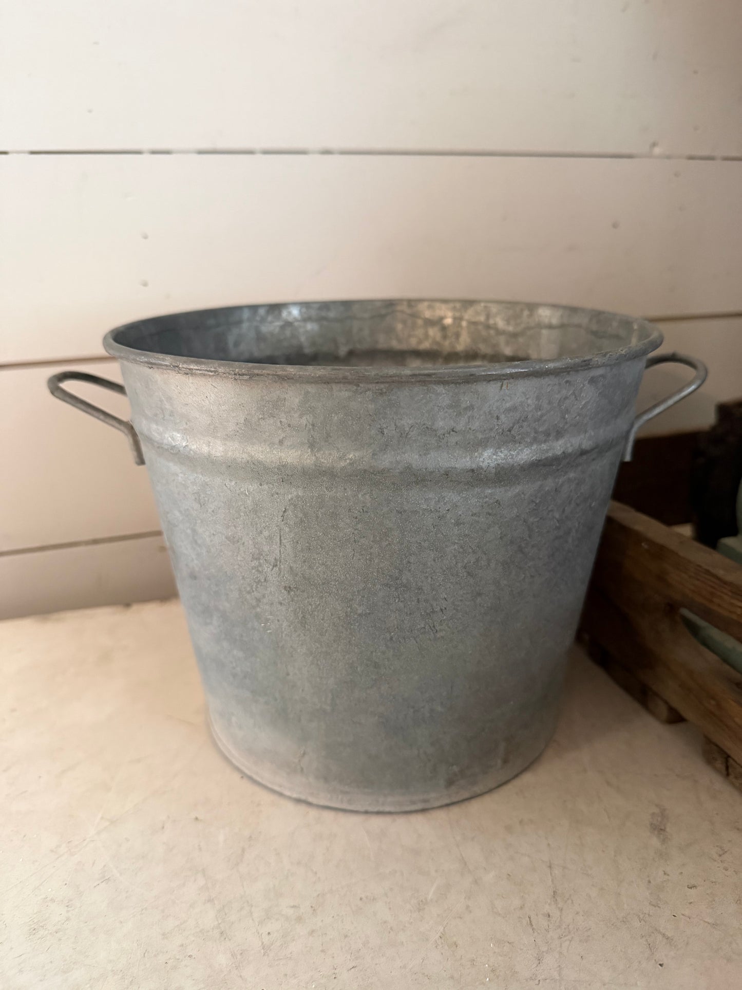 Galvanized bucket planter with holes