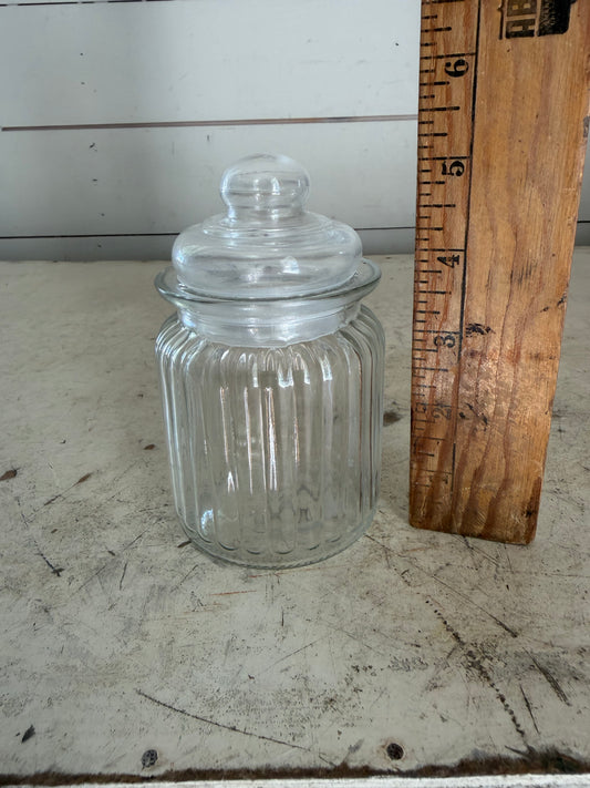 Clear, ribbed glass apothecary jar with lid