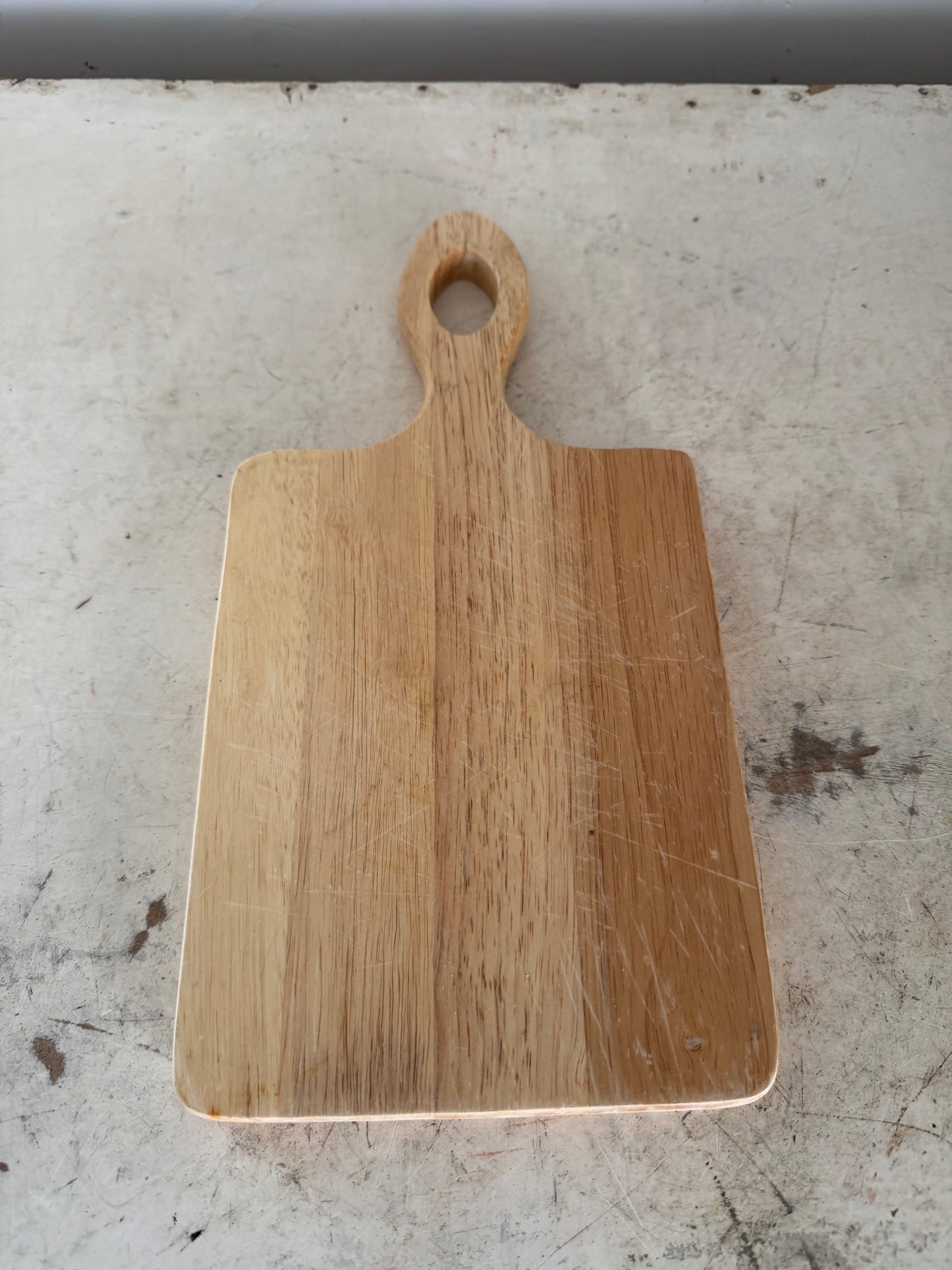Paddle style cutting board with hanging slot in the handle - will get makeover