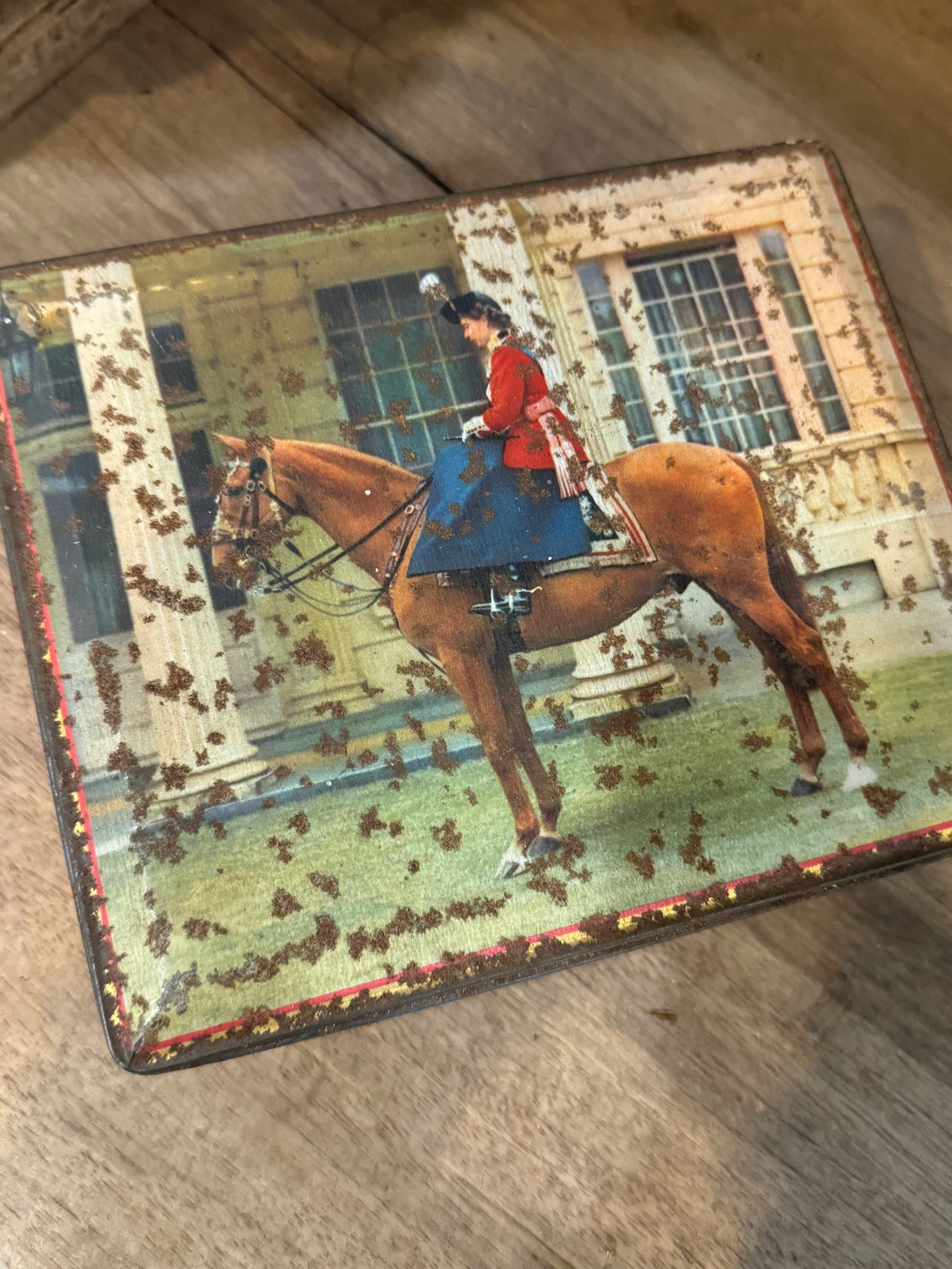 Edward Sharp & Sons hinged biscuit tin. Queen Elizabeth on horseback.