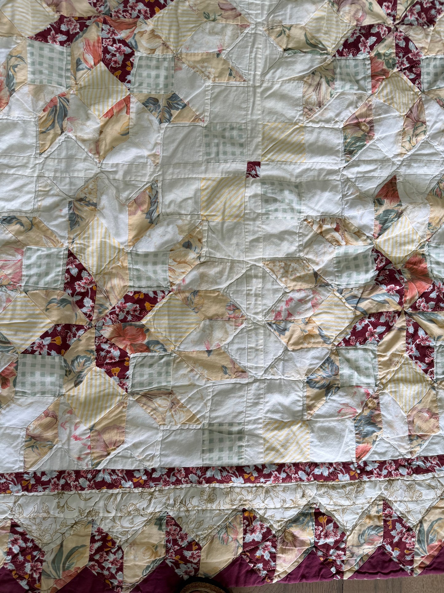 handmade quilt featuring a repeating star pattern full