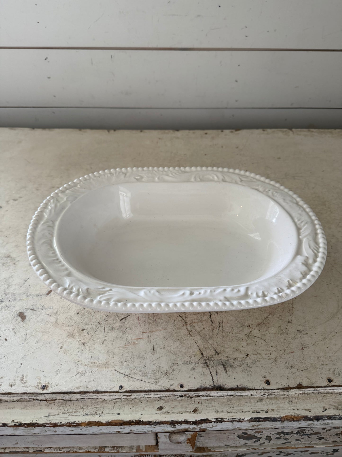Vintage oval, ceramic serving dish made in Italy small chip
