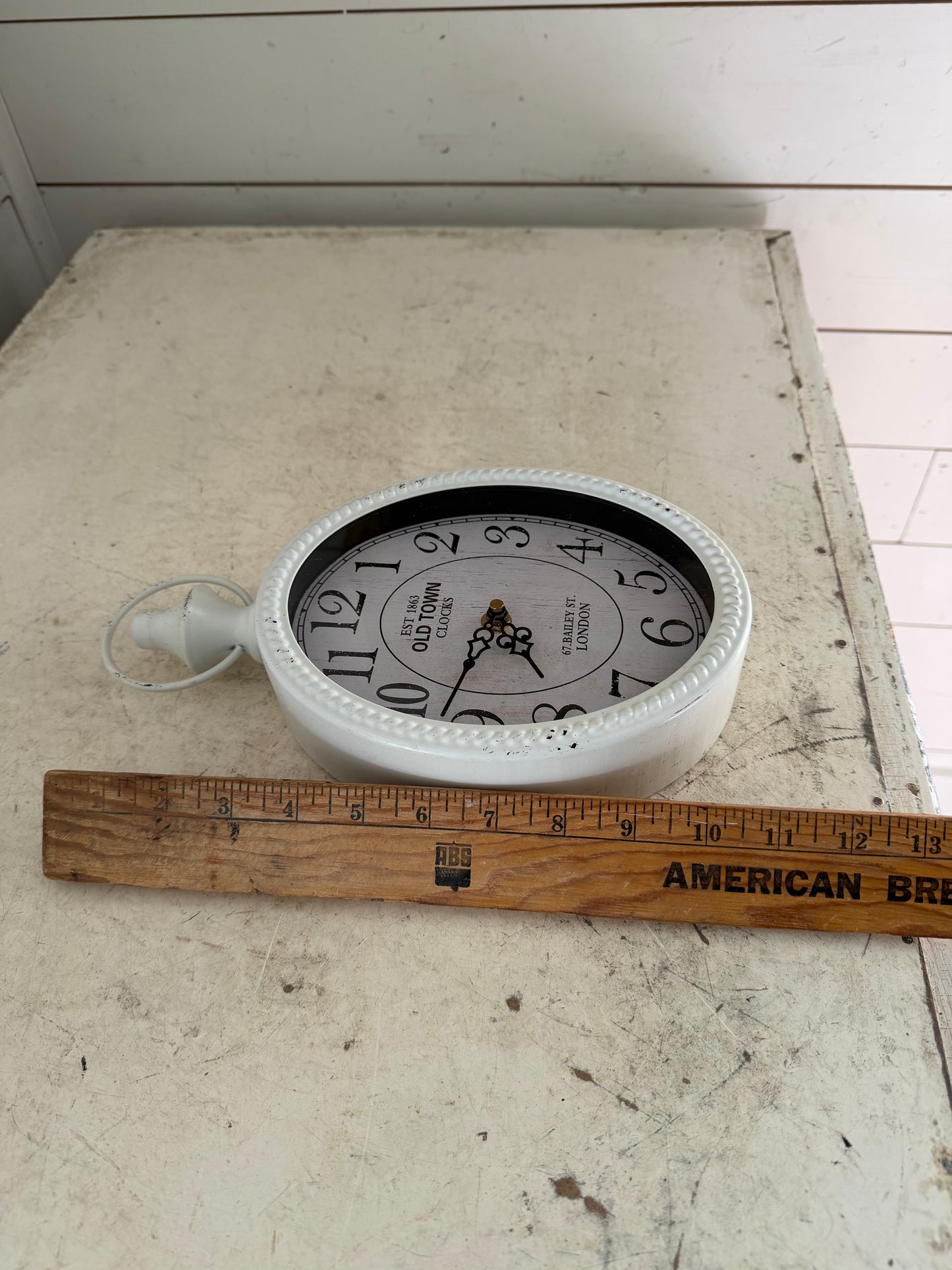 Small white Metal oval clock - will get makeover