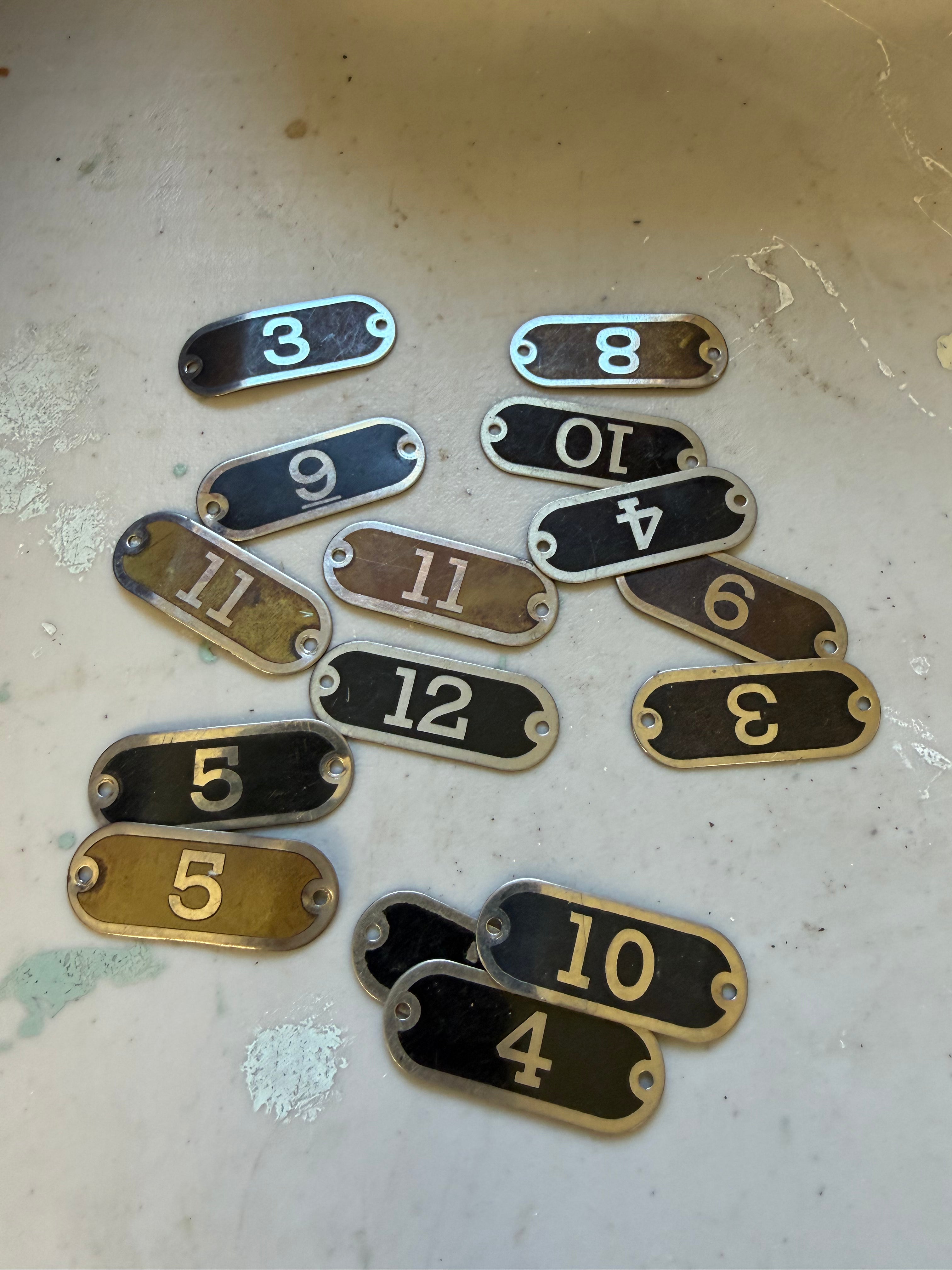 Set of 15 vintage brass locker tags