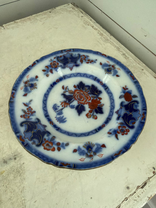 Flow blue plate made in England has small crack