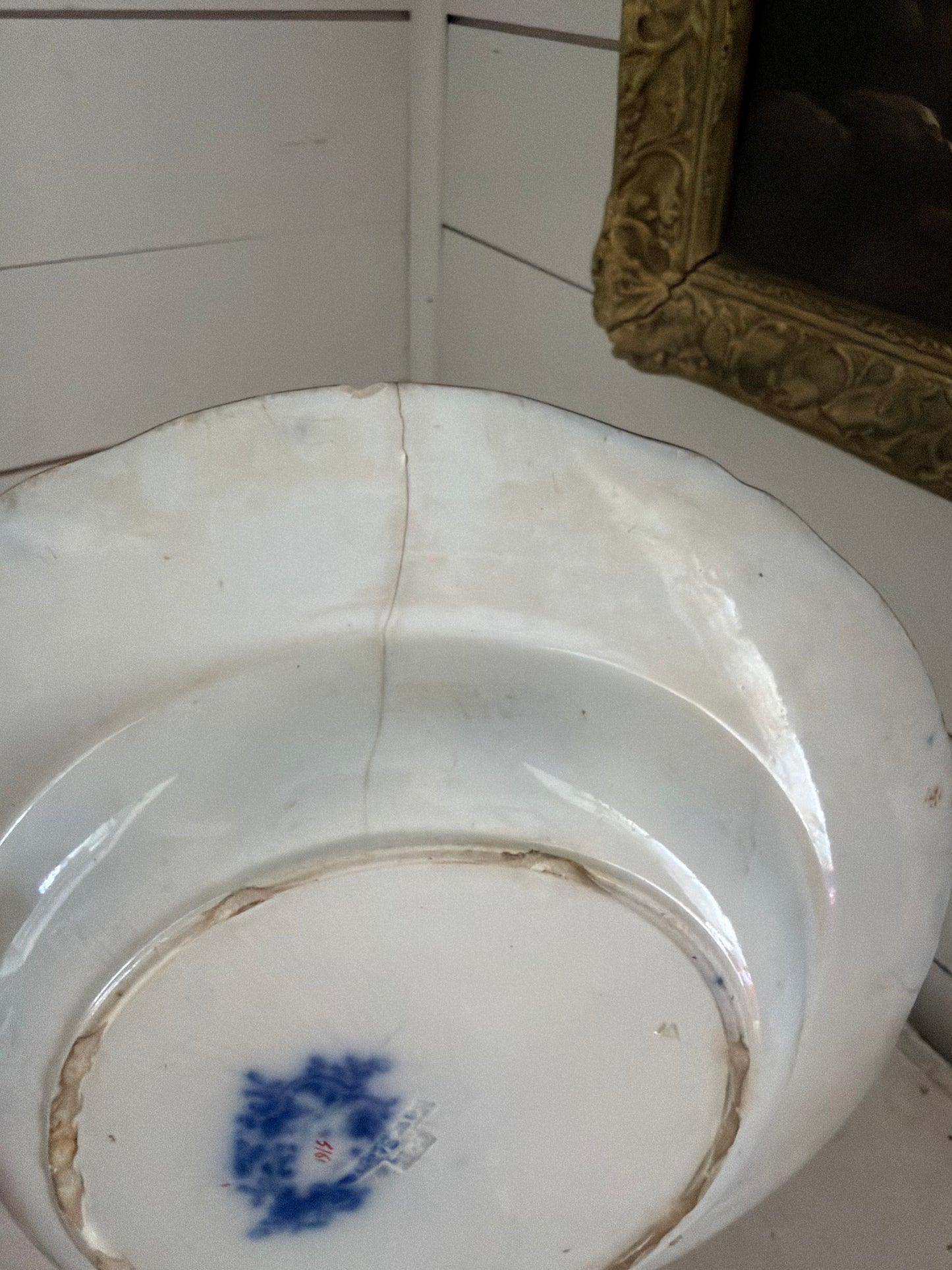 Flow blue plate made in England has small crack