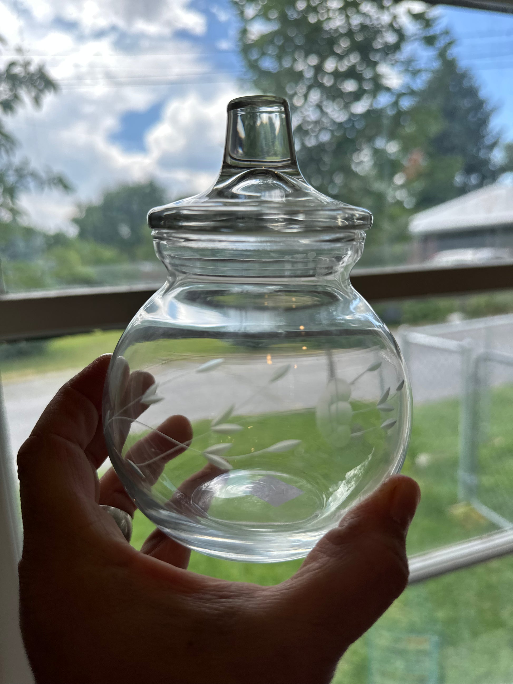 Vintage clear glass candy dish with etched flower design and lid