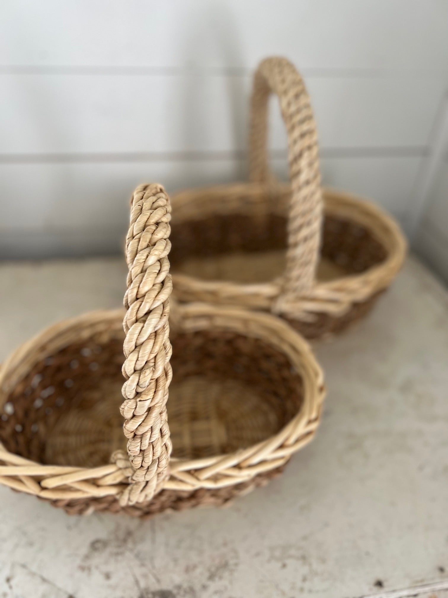 Set of stacking oval baskets with braided handle