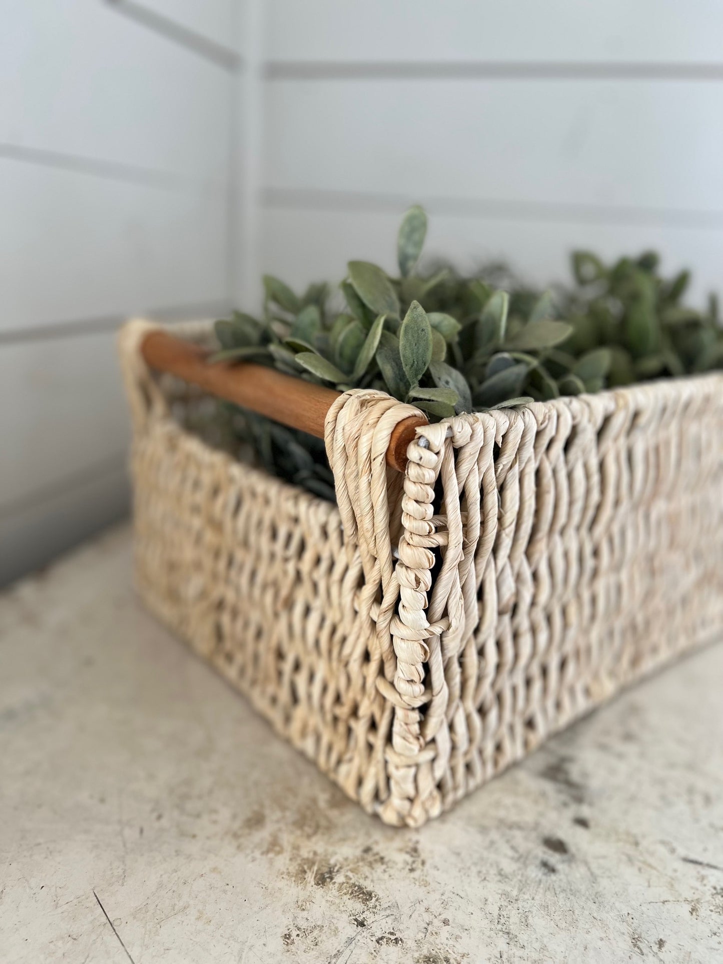 Light woven basket with wood handles